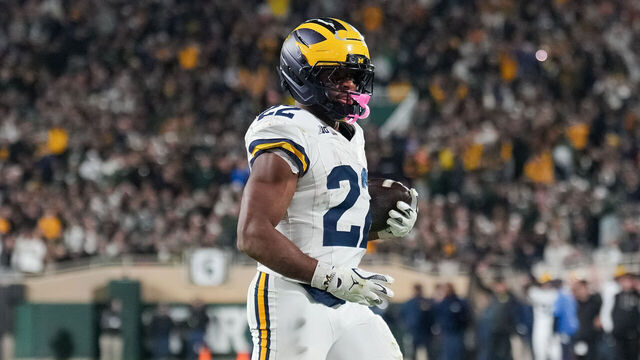 EAST LANSING, MICHIGAN - OCTOBER 25: Justice Haynes #22 of the Michigan Wolverines runs in action to score a touchdown against the Michigan State Spartans during the third quarter at Spartan Stadium on October 25, 2025 in East Lansing, Michigan.