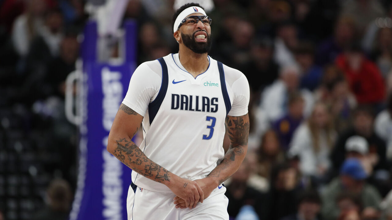 SALT LAKE CITY, UT - JANUARY 08: Anthony Davis #3 of the Dallas Mavericks holds his left hand as he reacts to pain after injuring it against Lauri Markkanen during the second half of their game at the Delta Center on January 8, 2026 in Salt Lake City, Utah.