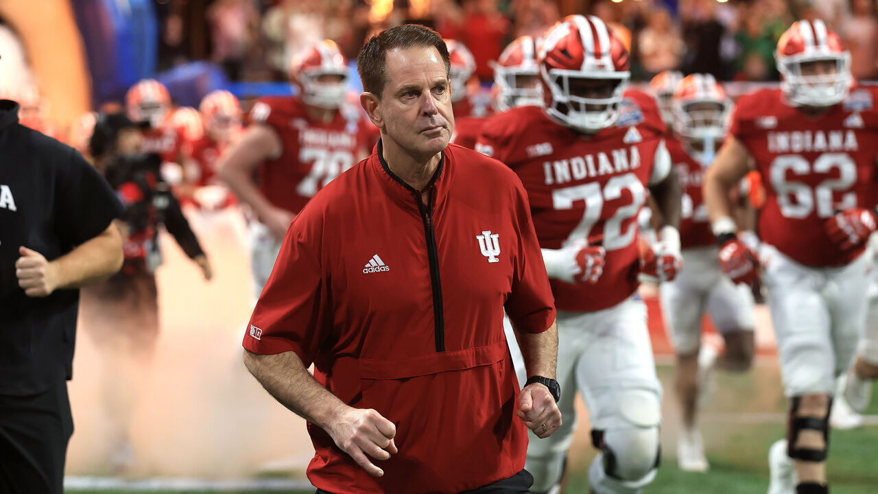 ATLANTA, GA - JANUARY 09: Head Coach Curt Cignetti of the Indiana Hoosiers leads his team onto the field for the Indiana Hoosiers versus Oregon Ducks College Football Playoff Semifinal at the Chick-fil-A Peach Bowl on January 9, 2026, at Mercedes-Benz Stadium in Atlanta, GA.