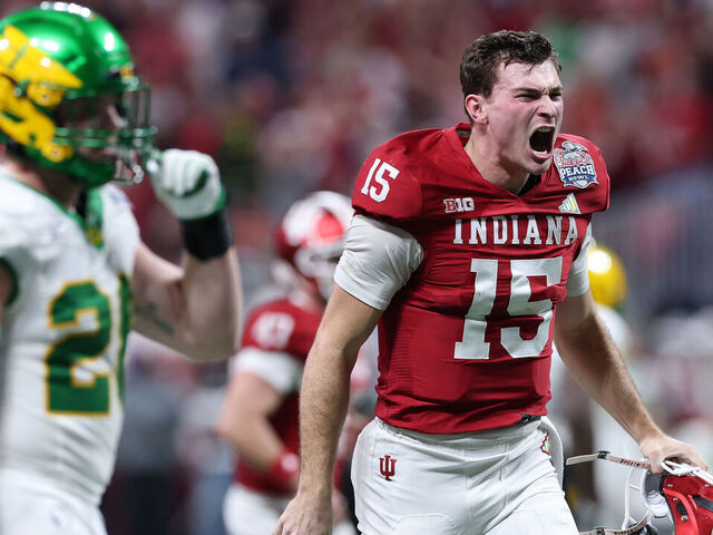 ATLANTA, GEORGIA - JANUARY 09: Fernando Mendoza #15 of the Indiana Hoosiers celebrates a touchdown pass against the Oregon Ducks during the second quarter in the 2025 College Football Playoff Semifinal at the Chick-fil-A Peach Bowl at Mercedes-Benz Stadium on January 09, 2026 in Atlanta, Georgia.