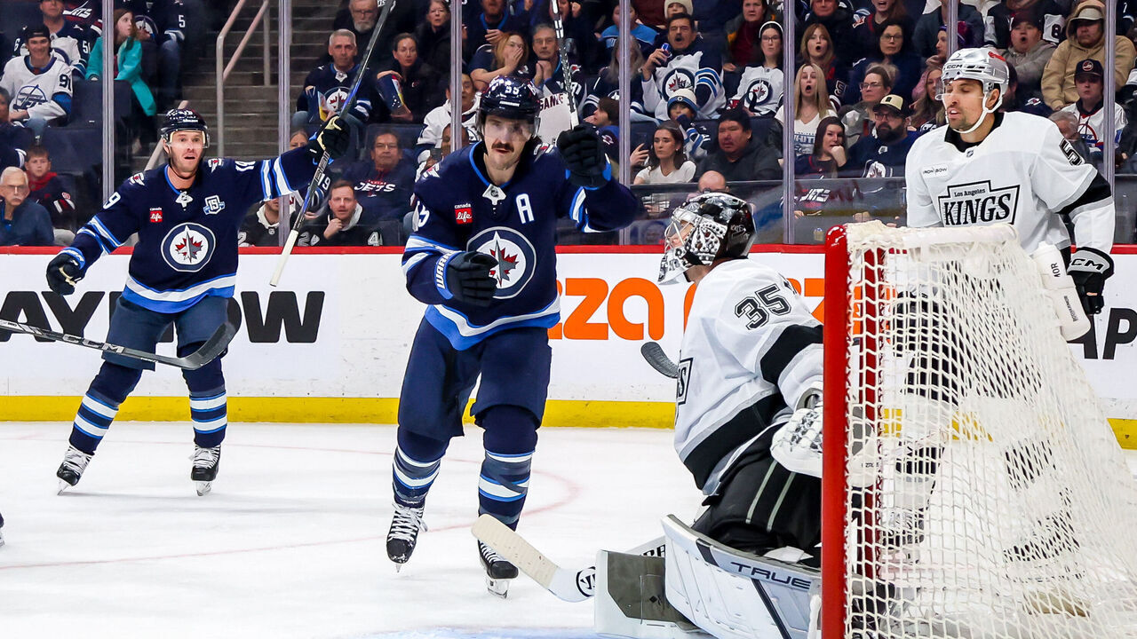 WINNIPEG, CANADA - JANUARY 9: Jonathan Toews #19 and Mark Scheifele #55 of the Winnipeg Jets celebrate a second period goal against the Los Angeles Kings at the Canada Life Centre on January 9, 2026 in Winnipeg, Manitoba, Canada.