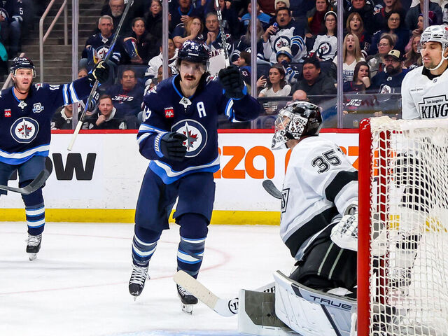 WINNIPEG, CANADA - JANUARY 9: Jonathan Toews #19 and Mark Scheifele #55 of the Winnipeg Jets celebrate a second period goal against the Los Angeles Kings at the Canada Life Centre on January 9, 2026 in Winnipeg, Manitoba, Canada.