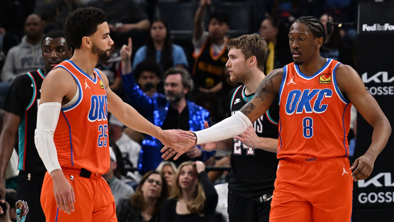MEMPHIS, TN - JANUARY 9: Ajay Mitchell #25 and Jalen Williams #8 of the Oklahoma City Thunder high five during the game against the Memphis Grizzlies on January 9, 2026 at FedExForum in Memphis, Tennessee. Mandatory Copyright Notice: Copyright 2025 NBAE