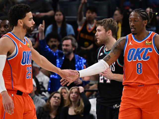 MEMPHIS, TN - JANUARY 9: Ajay Mitchell #25 and Jalen Williams #8 of the Oklahoma City Thunder high five during the game against the Memphis Grizzlies on January 9, 2026 at FedExForum in Memphis, Tennessee. Mandatory Copyright Notice: Copyright 2025 NBAE