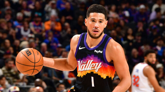 PHOENIX, AZ - JANUARY 9: Devin Booker #1 of the Phoenix Suns drives to the basket during the game against the New York Knicks on January 9, 2026 at PHX Arena in Phoenix, Arizona. Mandatory Copyright Notice: Copyright 2026 NBAE