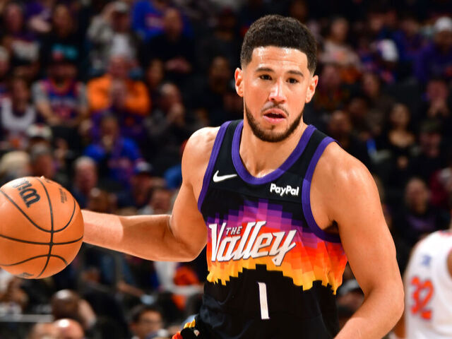 PHOENIX, AZ - JANUARY 9: Devin Booker #1 of the Phoenix Suns drives to the basket during the game against the New York Knicks on January 9, 2026 at PHX Arena in Phoenix, Arizona. Mandatory Copyright Notice: Copyright 2026 NBAE