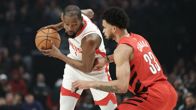 PORTLAND, OREGON - JANUARY 09: Kevin Durant #7 of the Houston Rockets keeps the ball away from Toumani Camara #33 of the Portland Trail Blazers during the first quarter at Moda Center on January 09, 2026 in Portland, Oregon.
