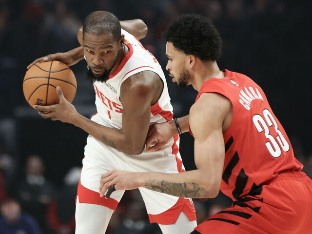 PORTLAND, OREGON - JANUARY 09: Kevin Durant #7 of the Houston Rockets keeps the ball away from Toumani Camara #33 of the Portland Trail Blazers during the first quarter at Moda Center on January 09, 2026 in Portland, Oregon.