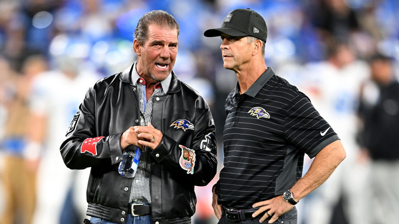 BALTIMORE, MARYLAND - SEPTEMBER 22: (L-R) Owner Steve Bisciotti and head coach John Harbaugh of the Baltimore Ravens interact before the game against the Detroit Lions at M&T Bank Stadium on September 22, 2025 in Baltimore, Maryland.