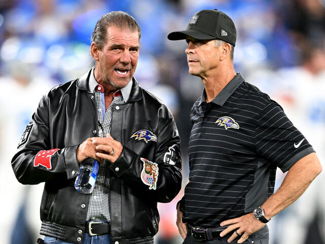 BALTIMORE, MARYLAND - SEPTEMBER 22: (L-R) Owner Steve Bisciotti and head coach John Harbaugh of the Baltimore Ravens interact before the game against the Detroit Lions at M&T Bank Stadium on September 22, 2025 in Baltimore, Maryland.