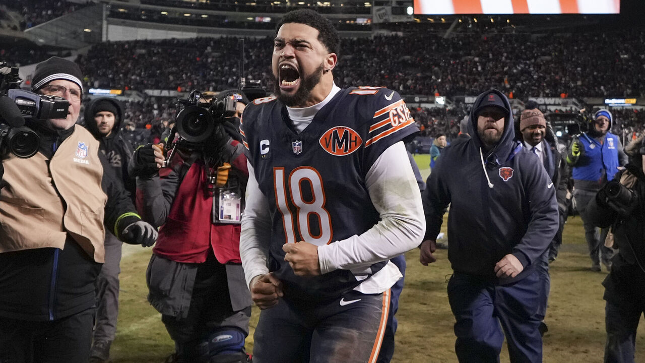 CHICAGO, ILLINOIS - JANUARY 10: Caleb Williams #18 of the Chicago Bears celebrates after an NFL Wild Card game against the Green Bay Packers at Solider Field on January 10, 2026 in Chicago, Illinois.