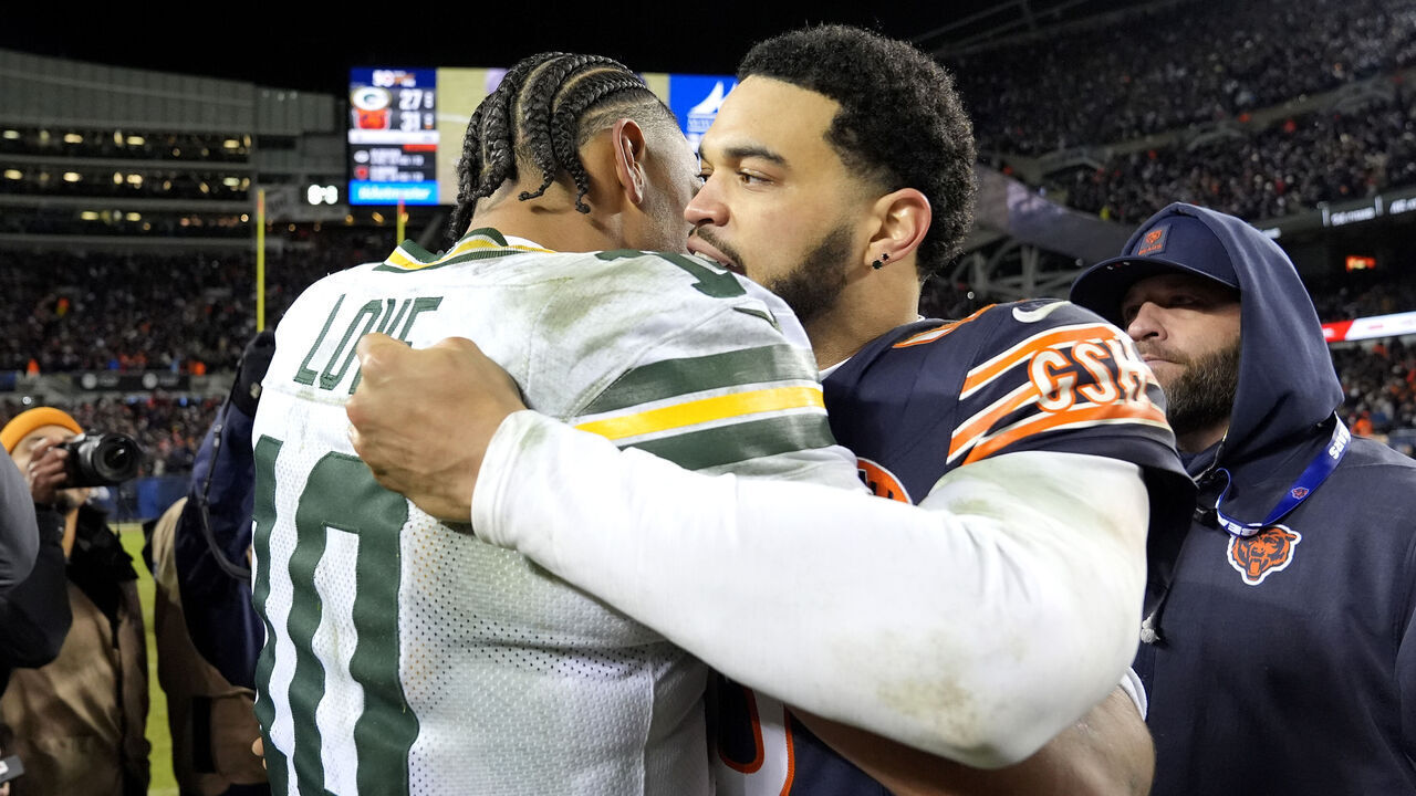 CHICAGO, ILLINOIS - JANUARY 10: (L-R) Jordan Love #10 of the Green Bay Packers embraces Caleb Williams #18 of the Chicago Bears after the NFC Wild Card Playoff game at Soldier Field on January 10, 2026 in Chicago, Illinois.