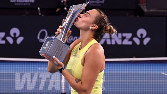 Aryna Sabalenka of Belarus celebrates with the trophy after winning the women's singles final against Marta Kostyuk of Ukraine at the Brisbane International tennis tournament in Brisbane on January 11, 2026. / --IMAGE RESTRICTED TO EDITORIAL USE - STRICTLY NO COMMERCIAL USE--