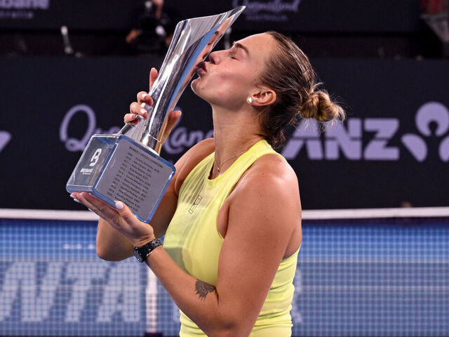 Aryna Sabalenka of Belarus celebrates with the trophy after winning the women's singles final against Marta Kostyuk of Ukraine at the Brisbane International tennis tournament in Brisbane on January 11, 2026. / --IMAGE RESTRICTED TO EDITORIAL USE - STRICTLY NO COMMERCIAL USE--