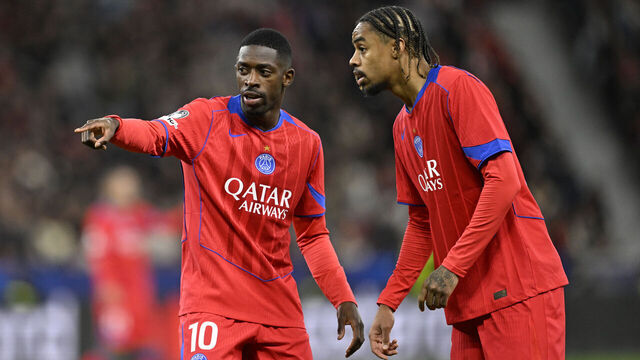 Paris Saint-Germain's French forward #10 Ousmane Dembele instructs Paris Saint-Germain's French forward #29 Bradley Barcola during the UEFA Champions League football match between Bayer 04 Leverkusen and Paris Saint-Germain (PSG) at the BayArena stadium in Leverkusen, western Germany on October 21, 2025.