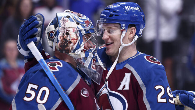DENVER, COLORADO - JANUARY 10: Trent Miner #50 and Nathan MacKinnon #29 of the Colorado Avalanche celebrate their 4-0 win over the Columbus Blue Jackets at Ball Arena on January 10, 2026 in Denver, Colorado.