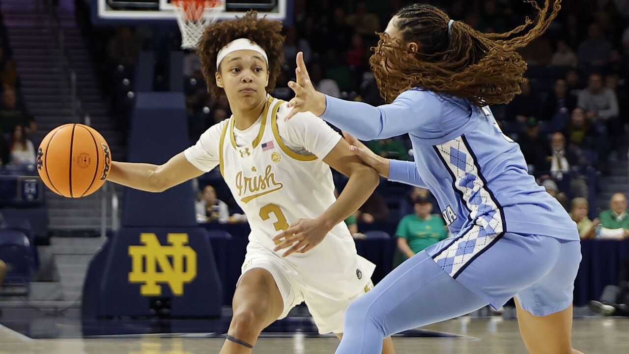 SOUTH BEND, IN - JANUARY 11: Notre Dame Fighting Irish guard Hannah Hidalgo (3) makes the pass around North Carolina Tar Heels guard Taliyah Henderson (3) in the second half of play during a women's college basketball game between the North Carolina Tar Heels and the Notre Dame Fighting Irish on January 11, 2026, at Purcell Pavilion in South Bend, IN.