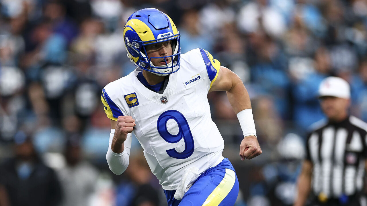 CHARLOTTE, NORTH CAROLINA - JANUARY 10: Matthew Stafford #9 of the Los Angeles Rams celebrates after a touchdown during the first quarter of an NFL wild card playoff game against the Carolina Panthers at Bank of America Stadium on January 10, 2026 in Charlotte, North Carolina.