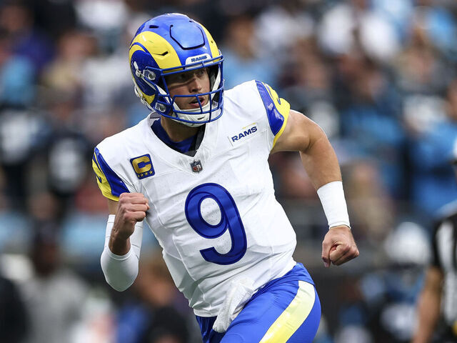 CHARLOTTE, NORTH CAROLINA - JANUARY 10: Matthew Stafford #9 of the Los Angeles Rams celebrates after a touchdown during the first quarter of an NFL wild card playoff game against the Carolina Panthers at Bank of America Stadium on January 10, 2026 in Charlotte, North Carolina.