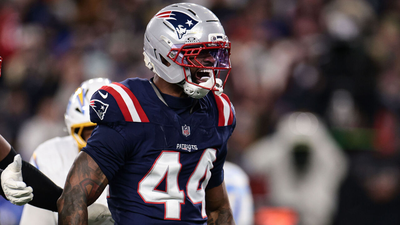 FOXBOROUGH, MASSACHUSETTS - JANUARY 11: Milton Williams #97 and K’Lavon Chaisson #44 of the New England Patriots react after a play during the second quarter of an AFC wild card playoff football game against the Los Angeles Chargers at Gillette Stadium on January 11, 2026 in Foxborough, Massachusetts.