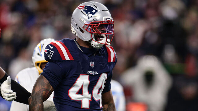 FOXBOROUGH, MASSACHUSETTS - JANUARY 11: Milton Williams #97 and K’Lavon Chaisson #44 of the New England Patriots react after a play during the second quarter of an AFC wild card playoff football game against the Los Angeles Chargers at Gillette Stadium on January 11, 2026 in Foxborough, Massachusetts.