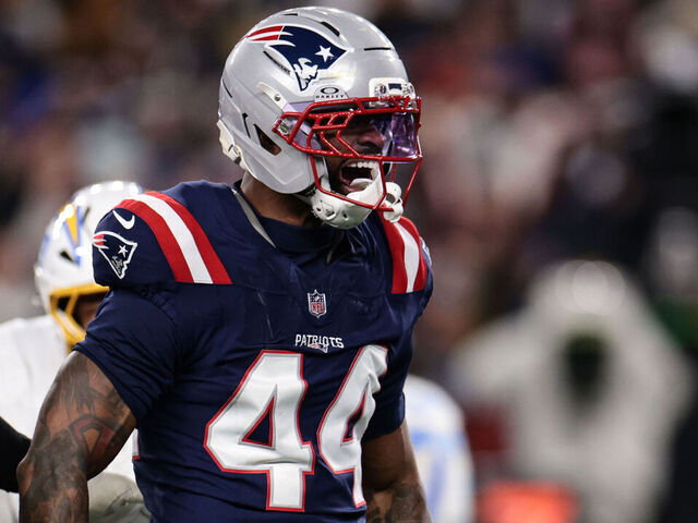FOXBOROUGH, MASSACHUSETTS - JANUARY 11: Milton Williams #97 and K’Lavon Chaisson #44 of the New England Patriots react after a play during the second quarter of an AFC wild card playoff football game against the Los Angeles Chargers at Gillette Stadium on January 11, 2026 in Foxborough, Massachusetts.