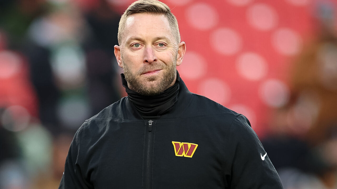 LANDOVER, MARYLAND - DECEMBER 20: Offensive coordinator Kliff Kingsbury of the Washington Commanders watches warmups before the NFL game against the Philadelphia Eagles at Northwest Stadium on December 20, 2025 in Landover, Maryland.