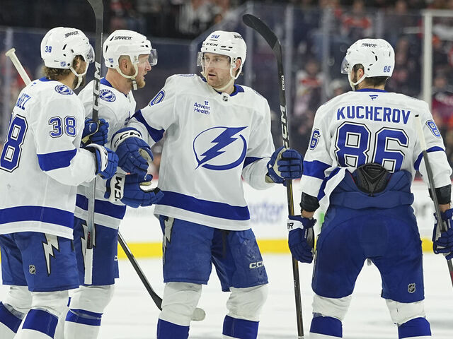 PHILADELPHIA, PENNSYLVANIA - JANUARY 12: Nikita Kucherov #86 of the Tampa Bay Lightning celebrates his goal with Brandon Hagel #38, Darren Raddysh #43 and J.J. Moser #90 against the Philadelphia Flyers in the third period at Xfinity Mobile Arena on January 12, 2026 in Philadelphia, Pennsylvania. The Tampa Bay Lightning defeated the Philadelphia Flyers 5-1.