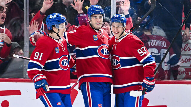 MONTREAL, CANADA - JANUARY 12: Juraj Slafkovský #20 of the Montréal Canadiens celebrates his goal with teammates Oliver Kapanen #91 and Ivan Demidov #93 during the third period against the Vancouver Canucks at the Bell Centre on January 12, 2026 in Montreal, Quebec, Canada. The Montréal Canadiens defeated the Vancouver Canucks 6-3.