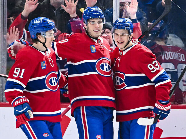 MONTREAL, CANADA - JANUARY 12: Juraj Slafkovský #20 of the Montréal Canadiens celebrates his goal with teammates Oliver Kapanen #91 and Ivan Demidov #93 during the third period against the Vancouver Canucks at the Bell Centre on January 12, 2026 in Montreal, Quebec, Canada. The Montréal Canadiens defeated the Vancouver Canucks 6-3.