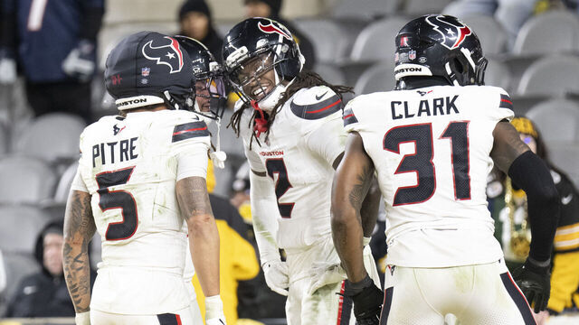 PITTSBURGH, PA - January 12: Houston Texans safety Calen Bullock (2) celebrates scoring a touchdown on a interception during the game between the Pittsburgh Steelers and the Houston Texans at Acrisure Stadium on January 12, 2026 in Pittsburgh, PA.
