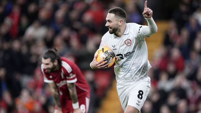 Barnsley's Adam Phillips celebrates scoring their side's first goal of the game as Liverpool's Dominik Szoboszlai stands dejected during the Emirates FA Cup third round match at Anfield, Liverpool. Picture date: Monday January 12, 2026.