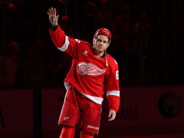 DETROIT, MICHIGAN - JANUARY 08: Patrick Kane #88 of the Detroit Red Wings celebrates with fans being named the first star of the game after a 5-1 win over the Vancouver Canucks where he scored his 500th career goal at Little Caesars Arena on January 08, 2026 in Detroit, Michigan.