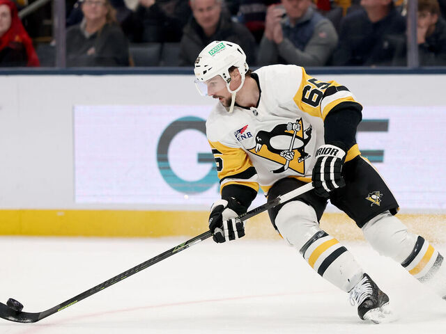 COLUMBUS, OHIO - JANUARY 4: Erik Karlsson #65 of the Pittsburgh Penguins controls the puck during the game against the Pittsburgh Penguins at Nationwide Arena on January 4, 2026 in Columbus, Ohio. Pittsburgh defeated Columbus 5-4 in overtime.