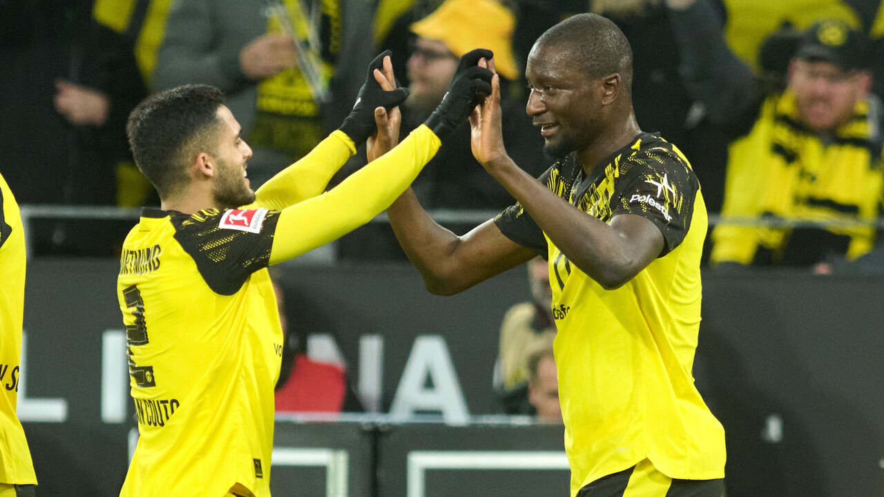 13 January 2026, North Rhine-Westphalia, Dortmund: Soccer: Bundesliga, Borussia Dortmund - Werder Bremen, Matchday 17, Signal Iduna Park. Serhou Guirassy (Borussia Dortmund) celebrates his goal for 3:0 with Yan Couto (Borussia Dortmund). Photo: Bernd Thissen/dpa - IMPORTANT NOTE: In accordance with the regulations of the DFL German Football League and the DFB German Football Association, it is prohibited to utilize or have utilized photographs taken in the stadium and/or of the match in the form of sequential images and/or video-like photo series.