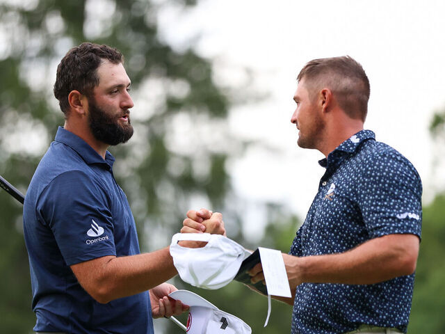 WHITE SULPHUR SPRINGS, WEST VIRGINIA - AUGUST 16: Jon Rahm of Spain hand shakes Bryson DeChambeau of the United States after finishing the 18th hole during day one of LIV Golf: Greenbrier at The Old White Course on August 16, 2024 in White Sulphur Springs, West Virginia.