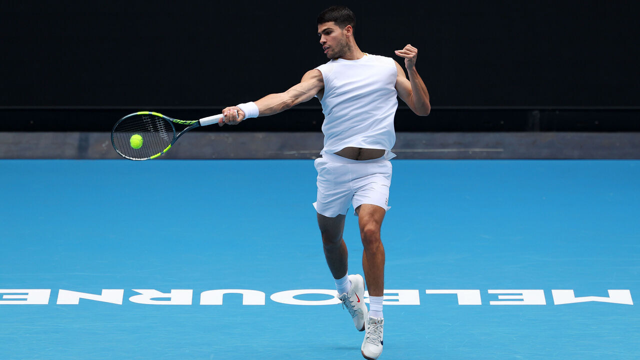 MELBOURNE, AUSTRALIA - JANUARY 14: Carlos Alcaraz of Spain plays a forehand during a practice session ahead of the 2026 Australian Open at Melbourne Park on January 14, 2026 in Melbourne, Australia.