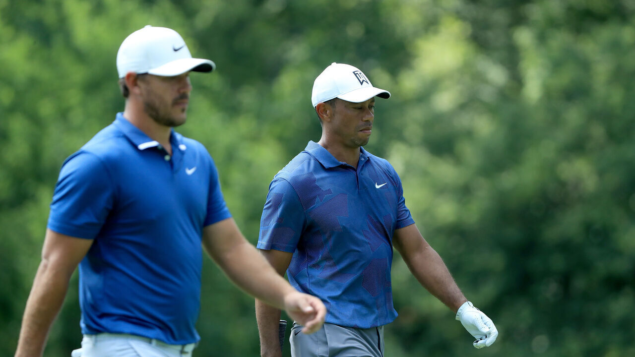DUBLIN, OHIO - JULY 17: Tiger Woods of the United States and Brooks Koepka of the United States walk during the second round of The Memorial Tournament on July 17, 2020 at Muirfield Village Golf Club in Dublin, Ohio.