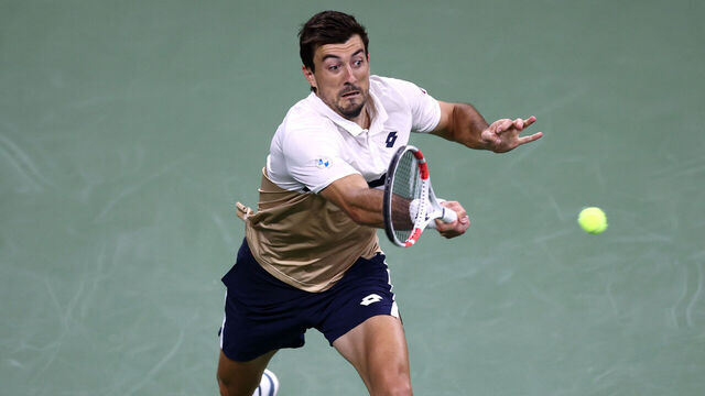 NEW YORK, NEW YORK - AUGUST 25: Sebastian Ofner of Austria returns a shot against Casper Ruud of Norway during their Men's Singles First Round match on Day Two of the 2025 US Open at USTA Billie Jean King National Tennis Center on August 25, 2025 in the Flushing neighborhood of the Queens borough of New York City.
