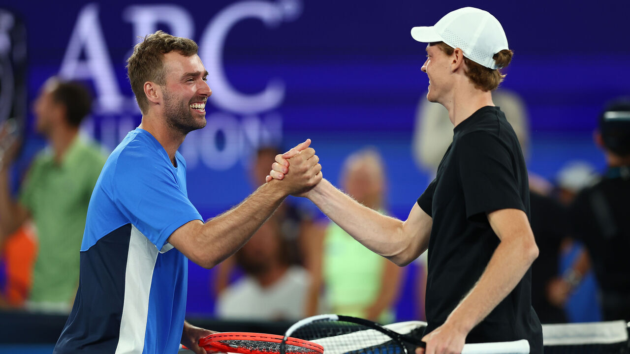 MELBOURNE, AUSTRALIA - JANUARY 14: Jordan Smith embraces Jannik Sinner of Italy during the 1 Point Slam ahead of the 2026 Australian Open at Melbourne Park on January 14, 2026 in Melbourne, Australia.