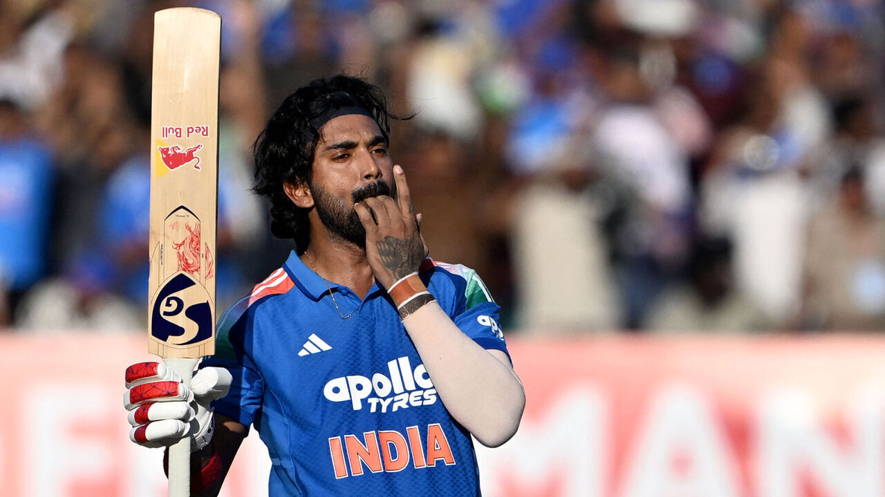 India's KL Rahul celebrates after scoring a century (100 runs) during the second one-day international (ODI) cricket match between India and New Zealand at Niranjan Shah Stadium in Rajkot on January 14, 2026. / -- IMAGE RESTRICTED TO EDITORIAL USE - STRICTLY NO COMMERCIAL USE --