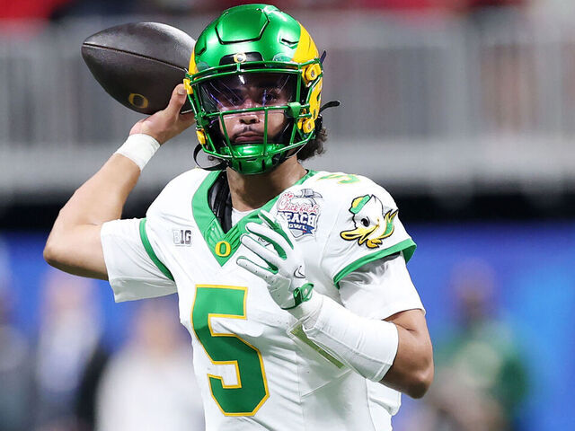 ATLANTA, GEORGIA - JANUARY 09: Dante Moore #5 of the Oregon Ducks passes against the Indiana Hoosiers during the first quarter in the 2025 College Football Playoff Semifinal at the Chick-fil-A Peach Bowl at Mercedes-Benz Stadium on January 09, 2026 in Atlanta, Georgia.