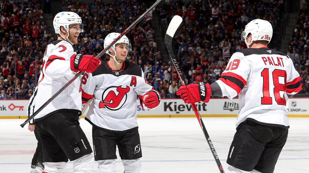 DENVER, COLORADO - OCTOBER 28: Dougie Hamilton #7, Jack Hughes #86 and Ondrej Palat #18 of the New Jersey Devils celebrate after a goal against the Colorado Avalanche at Ball Arena on October 28, 2025 in Denver, Colorado.