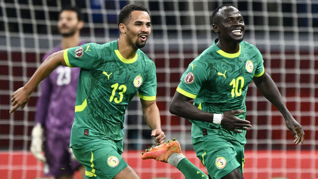 Senegal's forward #10 Sadio Mane celebrates his goal with Senegal's forward #13 Iliman Ndiaye during the Africa Cup of Nations (CAN) semi-final football match between Senegal and Egypt at the Grand stadium in Tangiers on January 14, 2026.