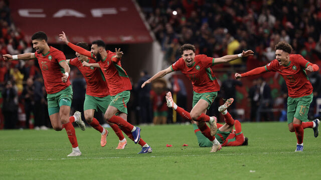 Morocco's players celebrate after winning the Africa Cup of Nations (CAN) semi-final football match between Nigeria and Morocco at the Prince Moulay Abdellah stadium in Rabat on January 14, 2026.