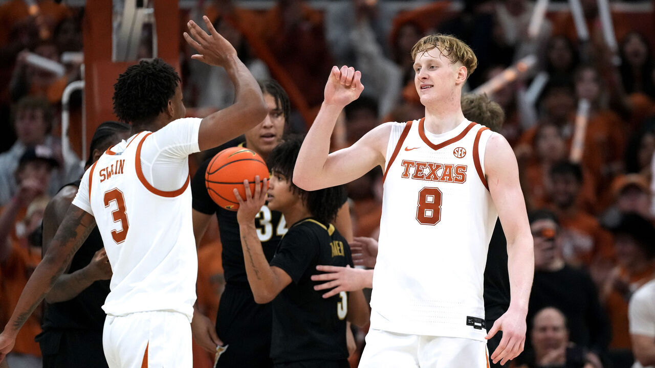 AUSTIN, TEXAS - JANUARY 14: Matas Vokietaitis #8 and Dailyn Swain #3 of the Texas Longhorns react after Vokietaitis drew a foul against the Vanderbilt Commodores during the second half at Moody Center on January 14, 2026 in Austin, Texas.