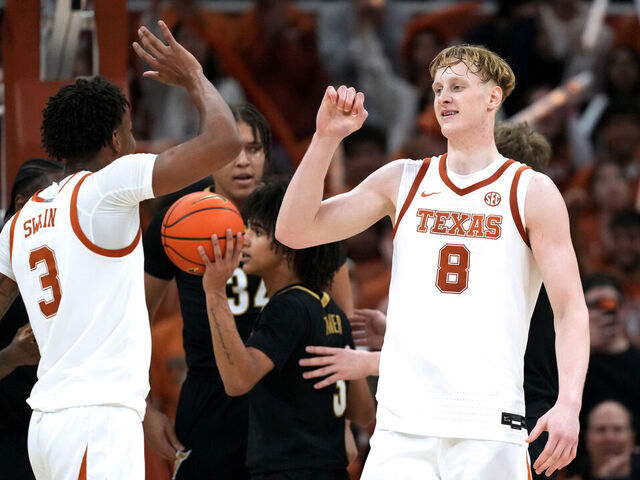 AUSTIN, TEXAS - JANUARY 14: Matas Vokietaitis #8 and Dailyn Swain #3 of the Texas Longhorns react after Vokietaitis drew a foul against the Vanderbilt Commodores during the second half at Moody Center on January 14, 2026 in Austin, Texas.
