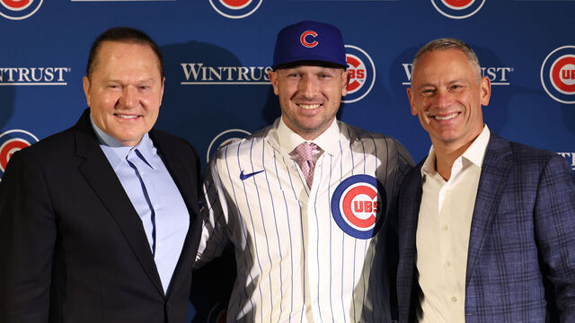 CHICAGO, ILLINOIS - JANUARY 15: Newly acquired Chicago Cubs player Alex Bregman poses for a picture with agent Scott Boras (left) and Chicago Cubs general manager Jed Hoyer (right) after a press conference at Wrigley Field on January 15, 2026 in Chicago, Illinois.