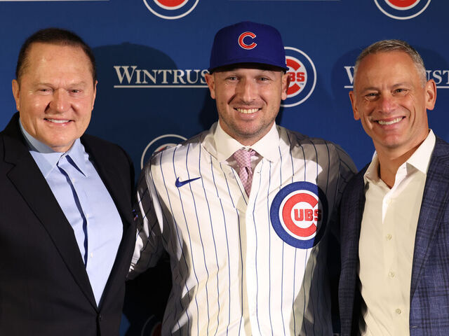 CHICAGO, ILLINOIS - JANUARY 15: Newly acquired Chicago Cubs player Alex Bregman poses for a picture with agent Scott Boras (left) and Chicago Cubs general manager Jed Hoyer (right) after a press conference at Wrigley Field on January 15, 2026 in Chicago, Illinois.