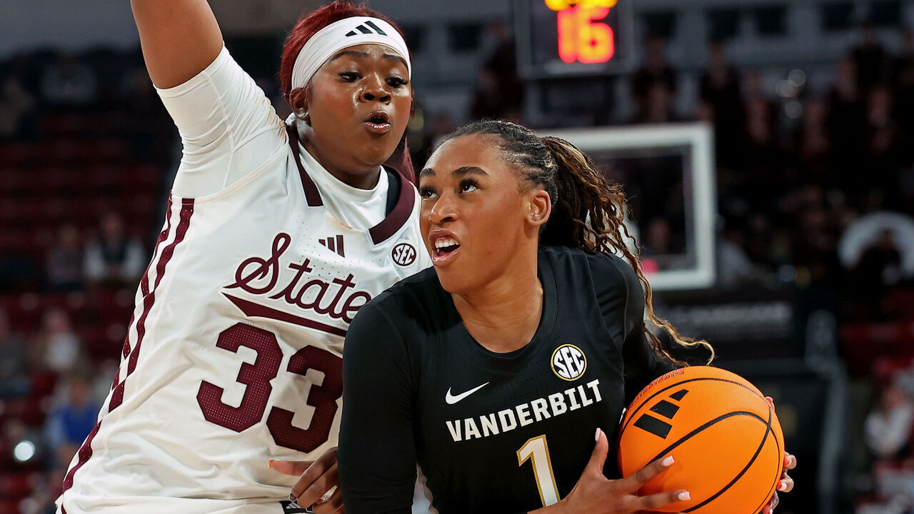 STARKVILLE, MISSISSIPPI - JANUARY 15: Mikayla Blakes #1 of the Vanderbilt Commodores goes to the basket in front of Kharyssa Richardson #33 of the Mississippi State Bulldogs during the second half at Humphrey Coliseum on January 15, 2026 in Starkville, Mississippi.